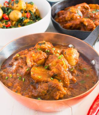 Restaurant style aloo chaat chicken curry is a salty sour medium spicy potato and chicken curry.