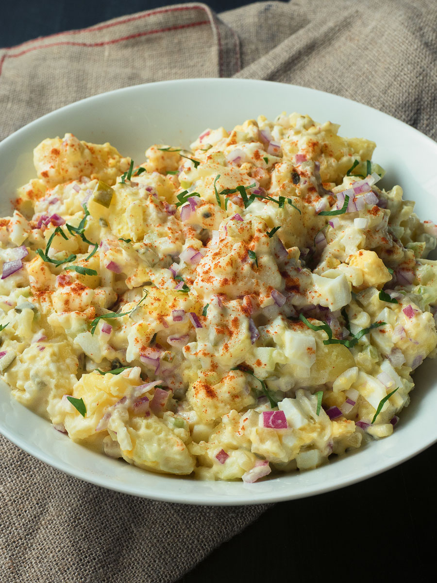 This may be the best potato salad you've ever tasted. Heavy on the eggs with pickle juice as the secret ingredient this potato salad is sure to please.