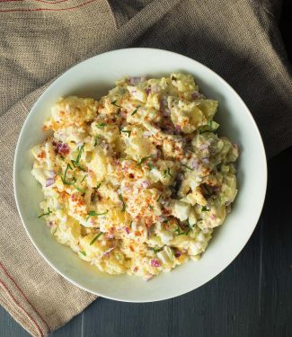 This may be the best potato salad you've ever tasted. Heavy on the eggs with pickle juice as the secret ingredient this potato salad is sure to please.