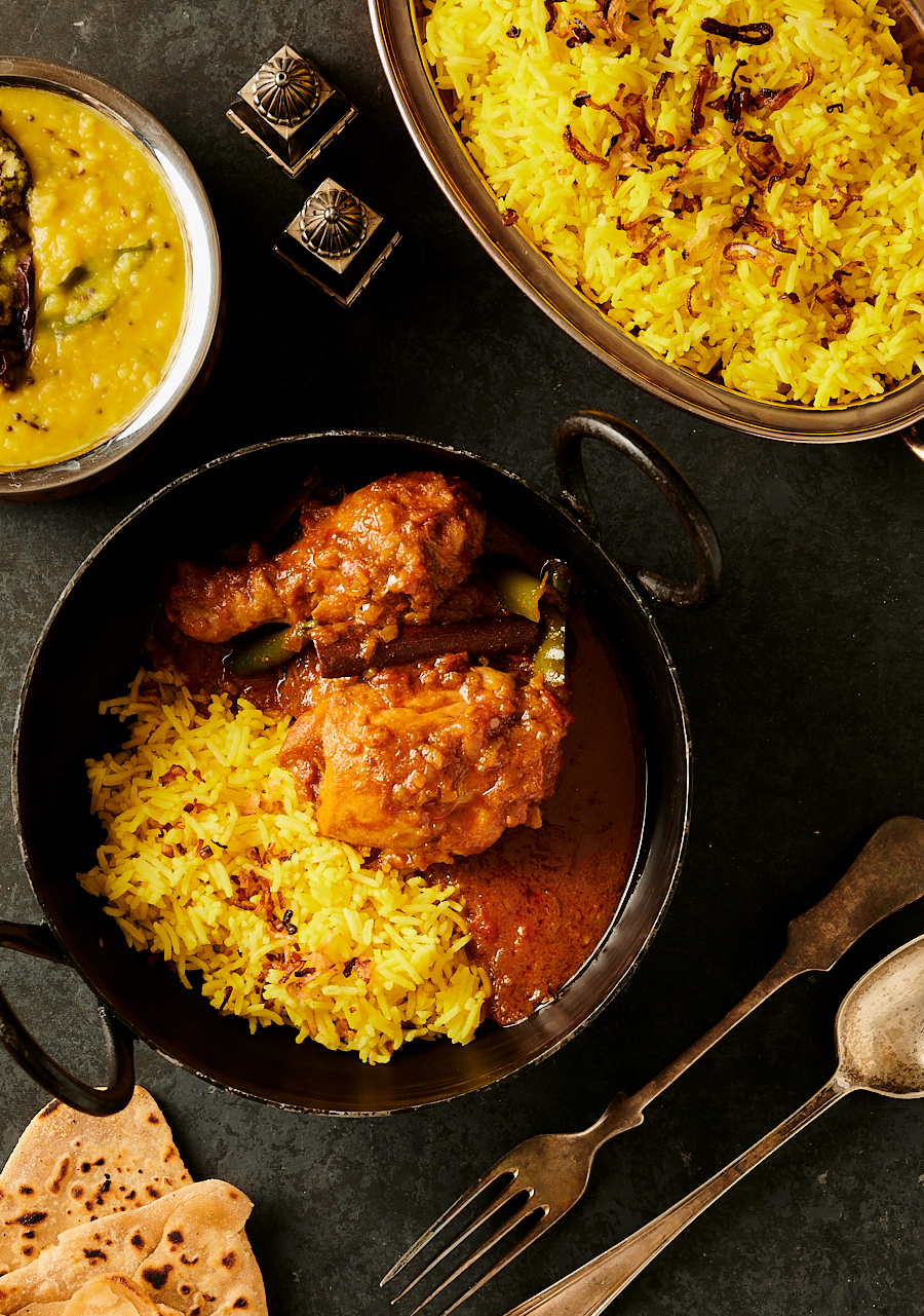 Bowl of simple chicken curry with rice and gravy from above