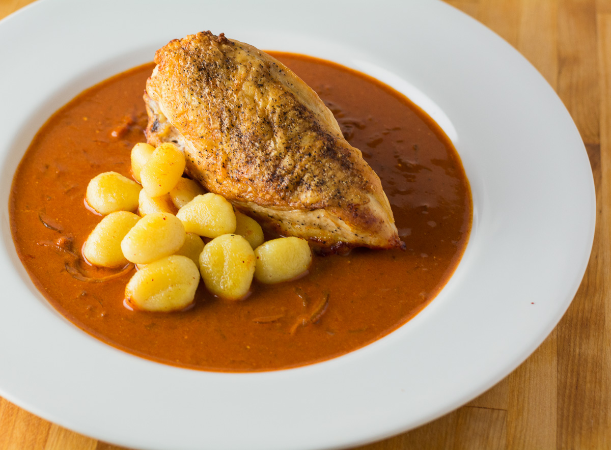 Chicken paprikash is traditionally braised. Try this recipe to keep the skin crisp while maintaining the depth of flavour of a braised dish
