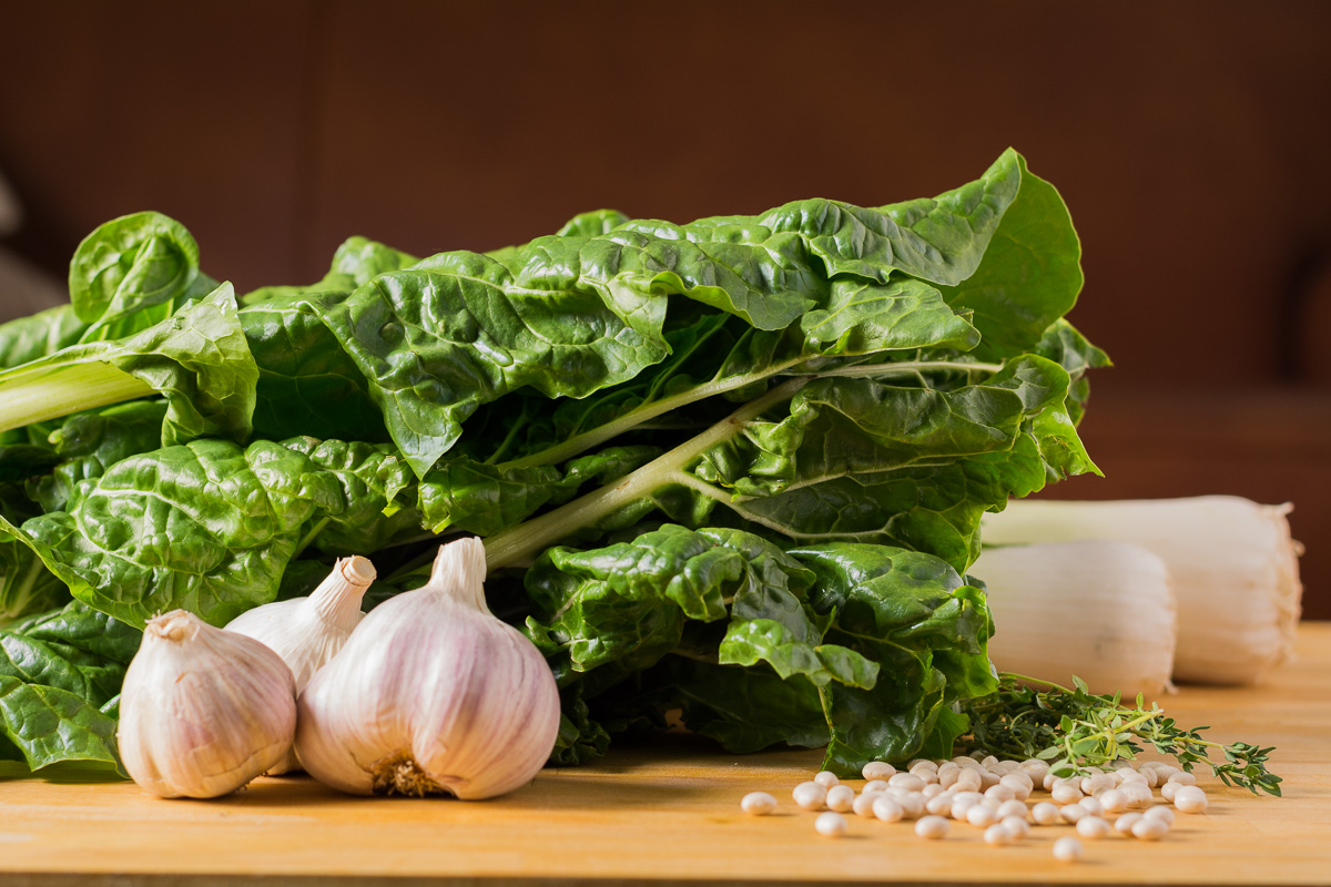 White bean swiss chard soup with leeks and bacon. A hearty, warming soup that chases away the winter blahs no matter how miserable it is out.