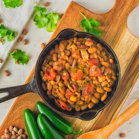 These Mexican pinto beans are better than you will get in restaurants. Rich, savoury and oh so satisfying, they go with anything and everything.