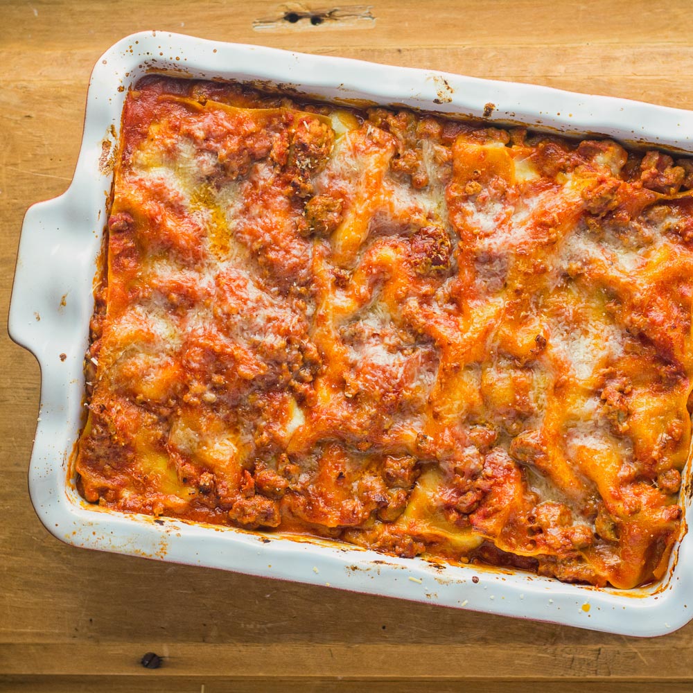 Neapolitan lasagna is a great alternative to your regular lasagna. Pork and Italian sausage meld beautifully with tomato and fresh mozzarella.