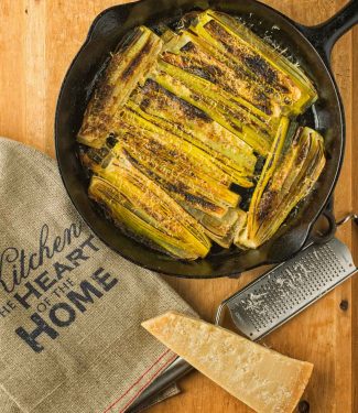 Braised leeks sprinkled with parmesan and flash broiled.