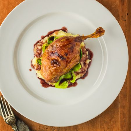 Roast duck with parsnip puree and port wine sauce.