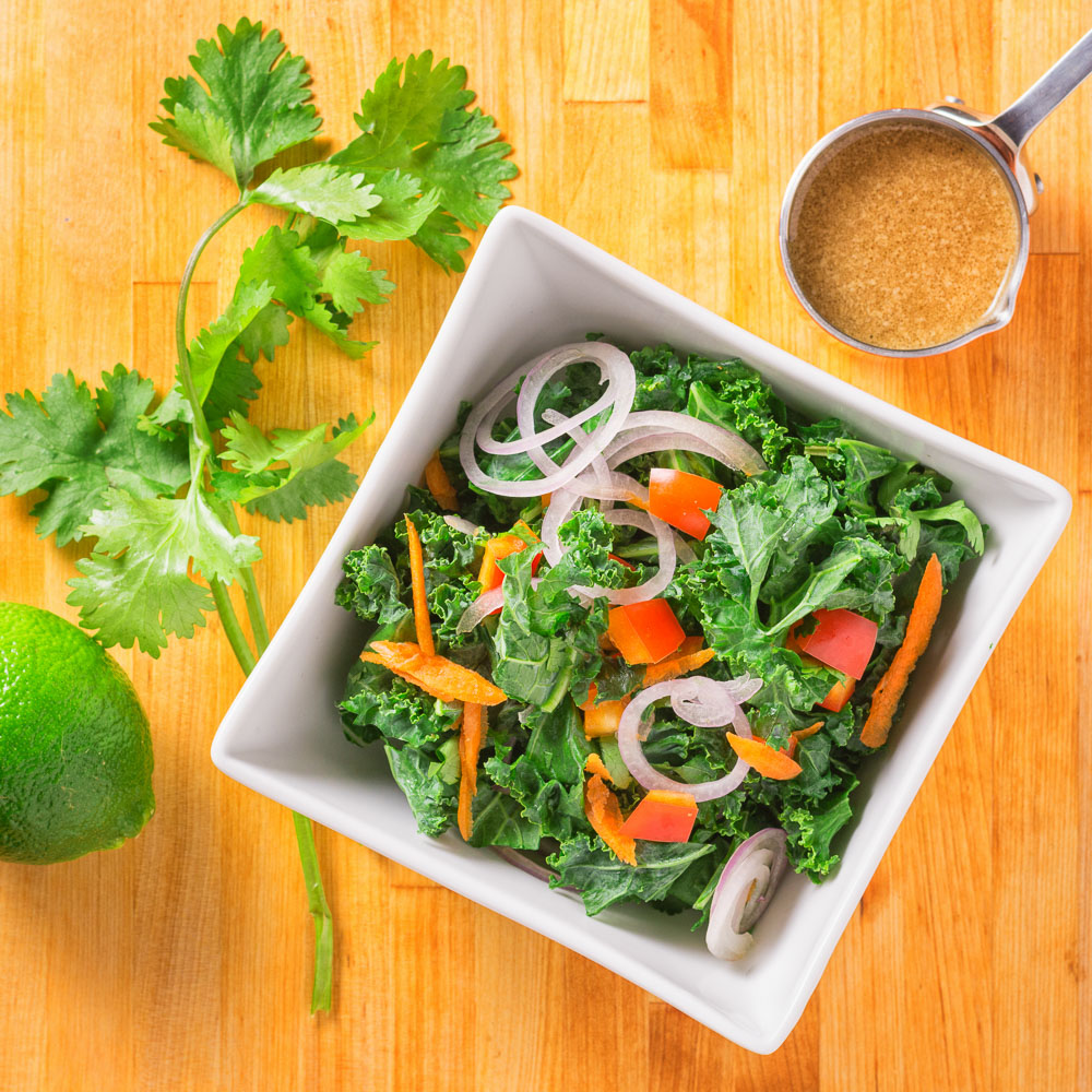Lime, soy and tahini dress this healthy kale salad.