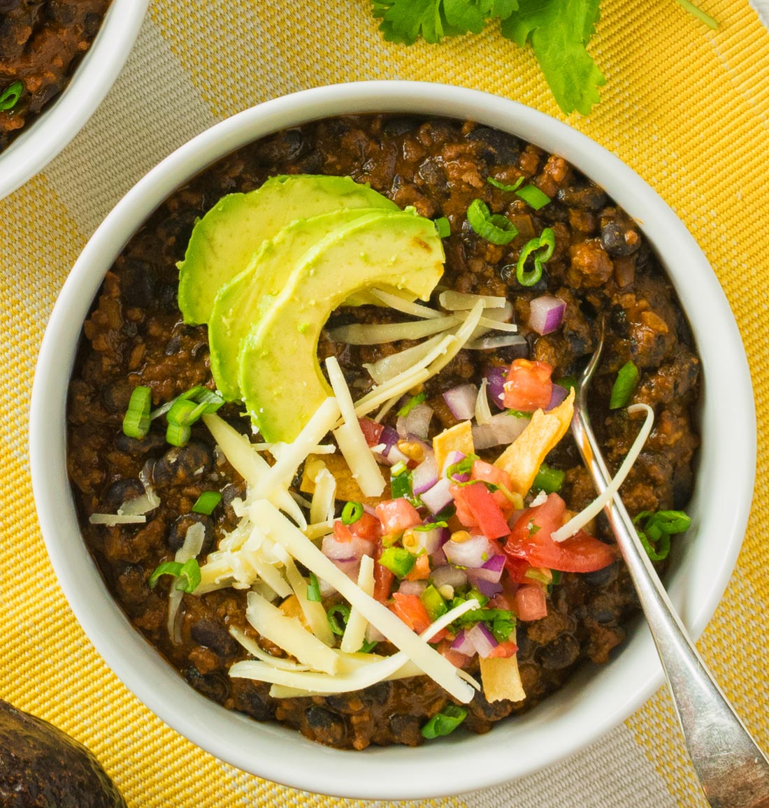 Pork, beef, new mexican red chili powder and fire roasted tomatoes all star in this black bean chili. This chili is for lovers of big flavours!