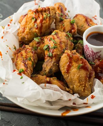 korean fried chicken wings with gochujang drizzle
