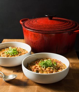 Rosemary, thyme, parsley, onion and garlic all come together in this warming and deeply satisfying savory navy bean stew.