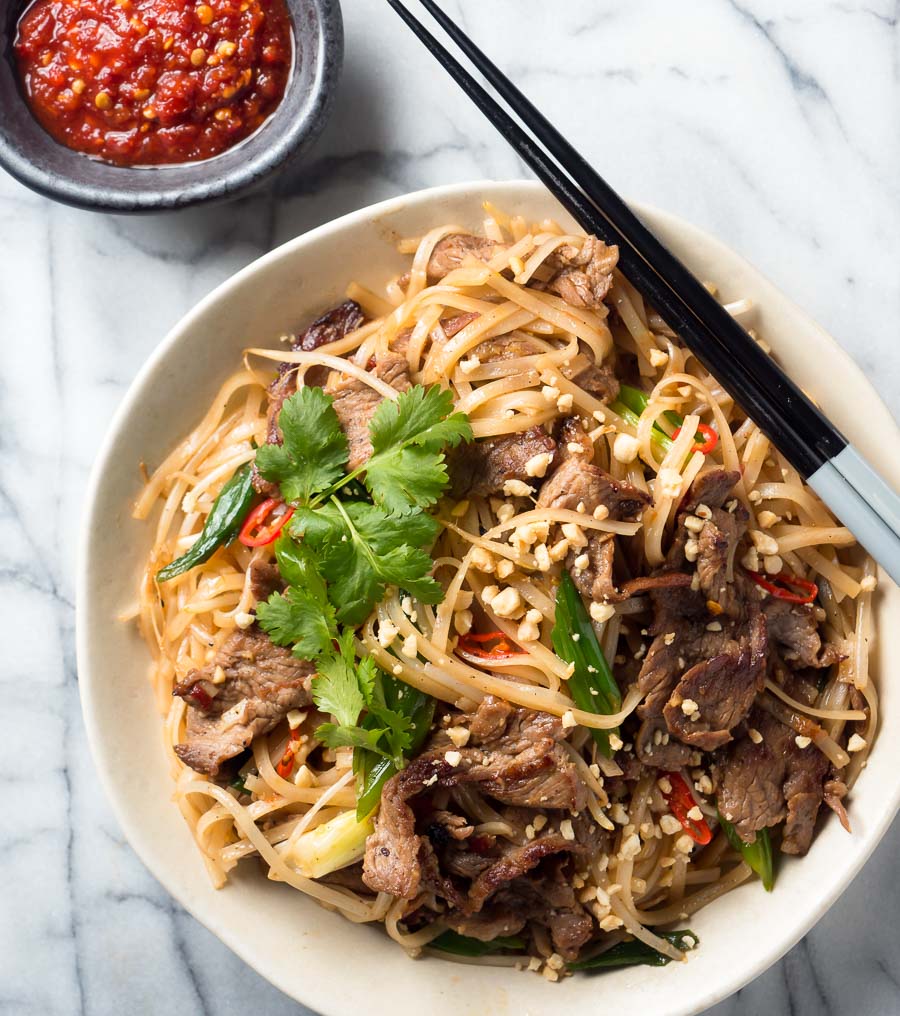 Thai beef noodles with chopsticks from above