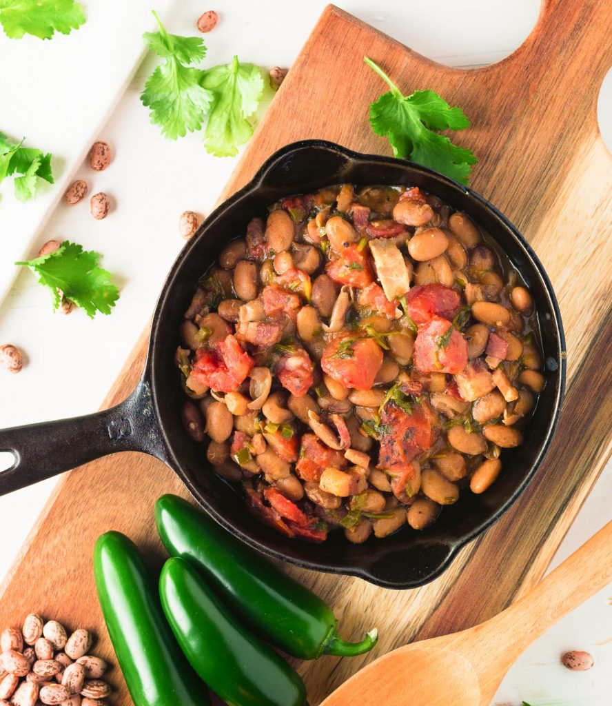 These Mexican pinto beans are better than you will get in restaurants. Rich, savoury and oh so satisfying, they go with anything and everything.