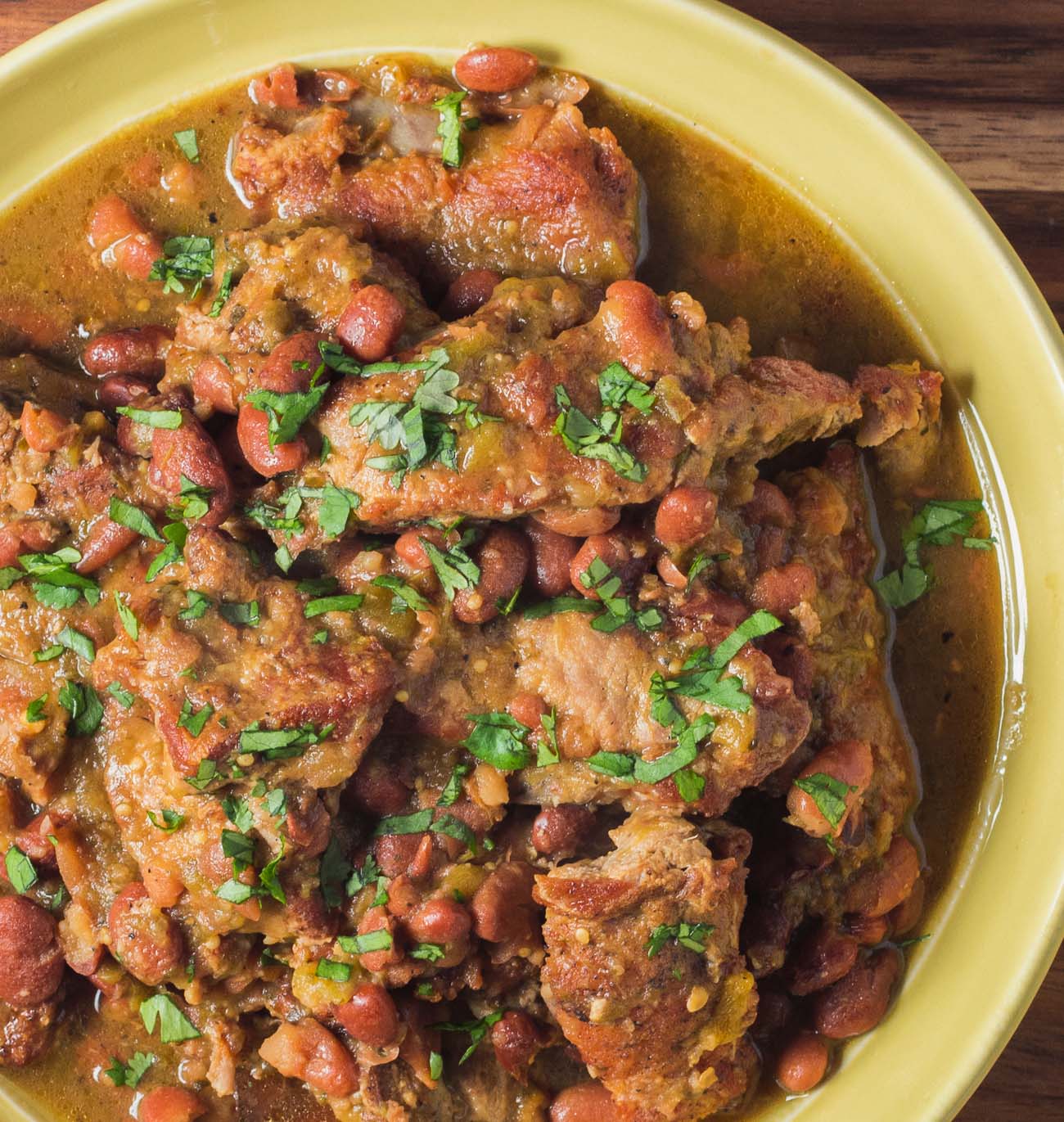 Braised pork with tomatillos and pinto bean chili