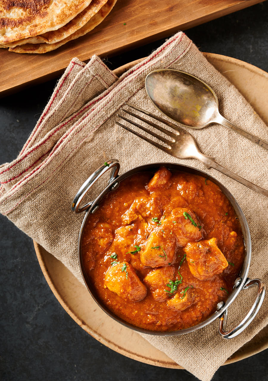 Indian restaurant dhansak curry in a karai bowl from above.