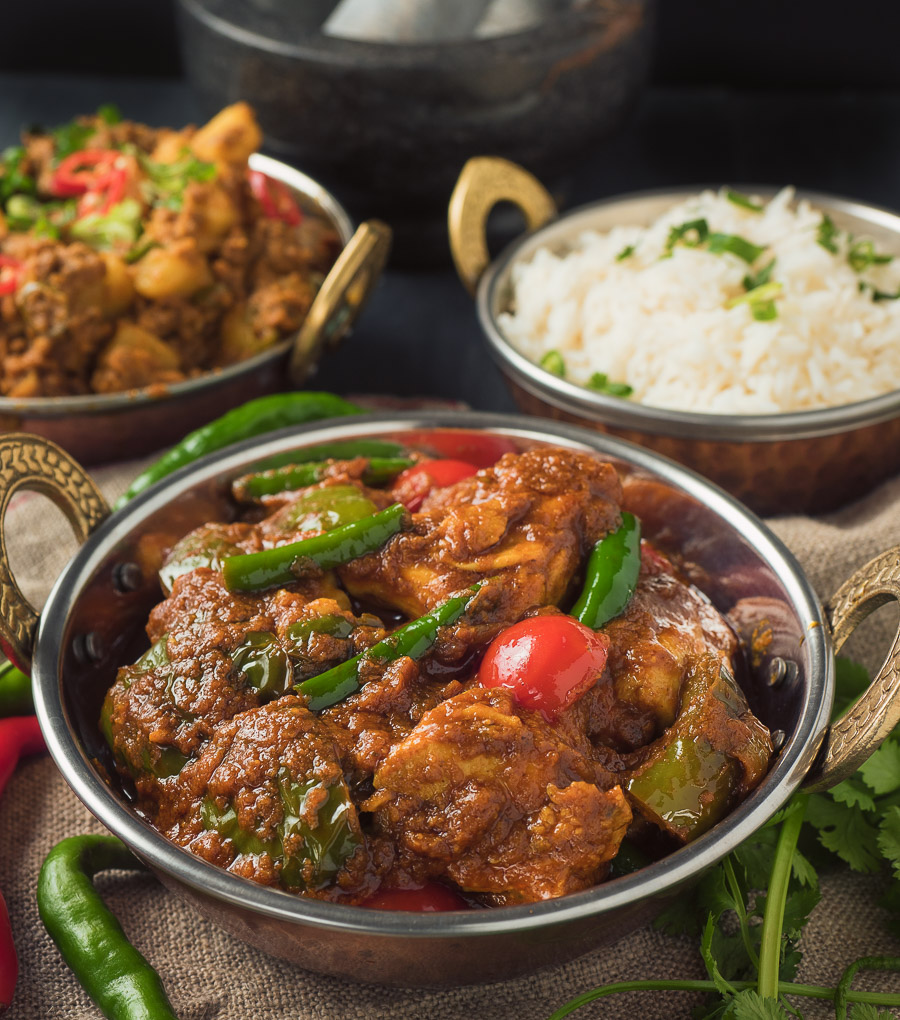 front view of Indian restaurant chicken jalfrezi with rice and aloo keema