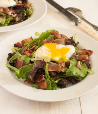 Salade lyonnaise is a classic French salad with poached egg and bacon.