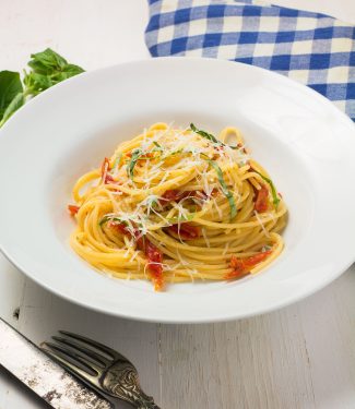 Spaghetti with sun-dried tomatoes and pecorino romano is a delicious weeknight meal.