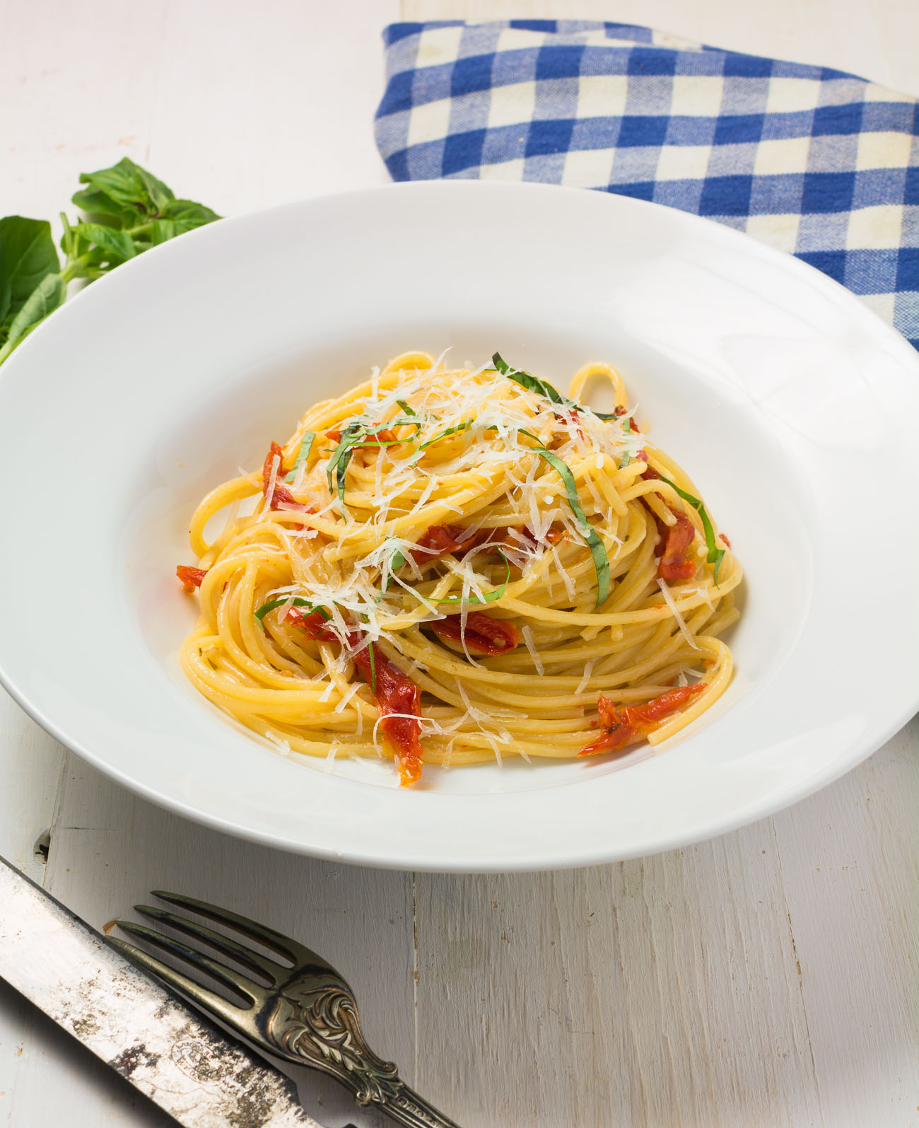 Spaghetti with sun-dried tomatoes and pecorino romano is a delicious weeknight meal.