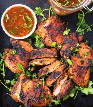 Thai grilled chicken with sweet chili sauce is a delicious way to mix up your summer grilling.
