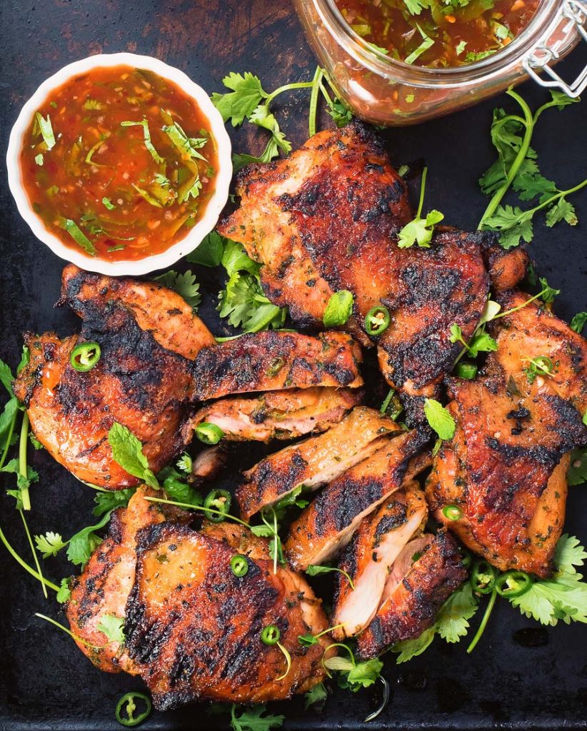 Thai grilled chicken with sweet chili sauce is a delicious way to mix up your summer grilling.