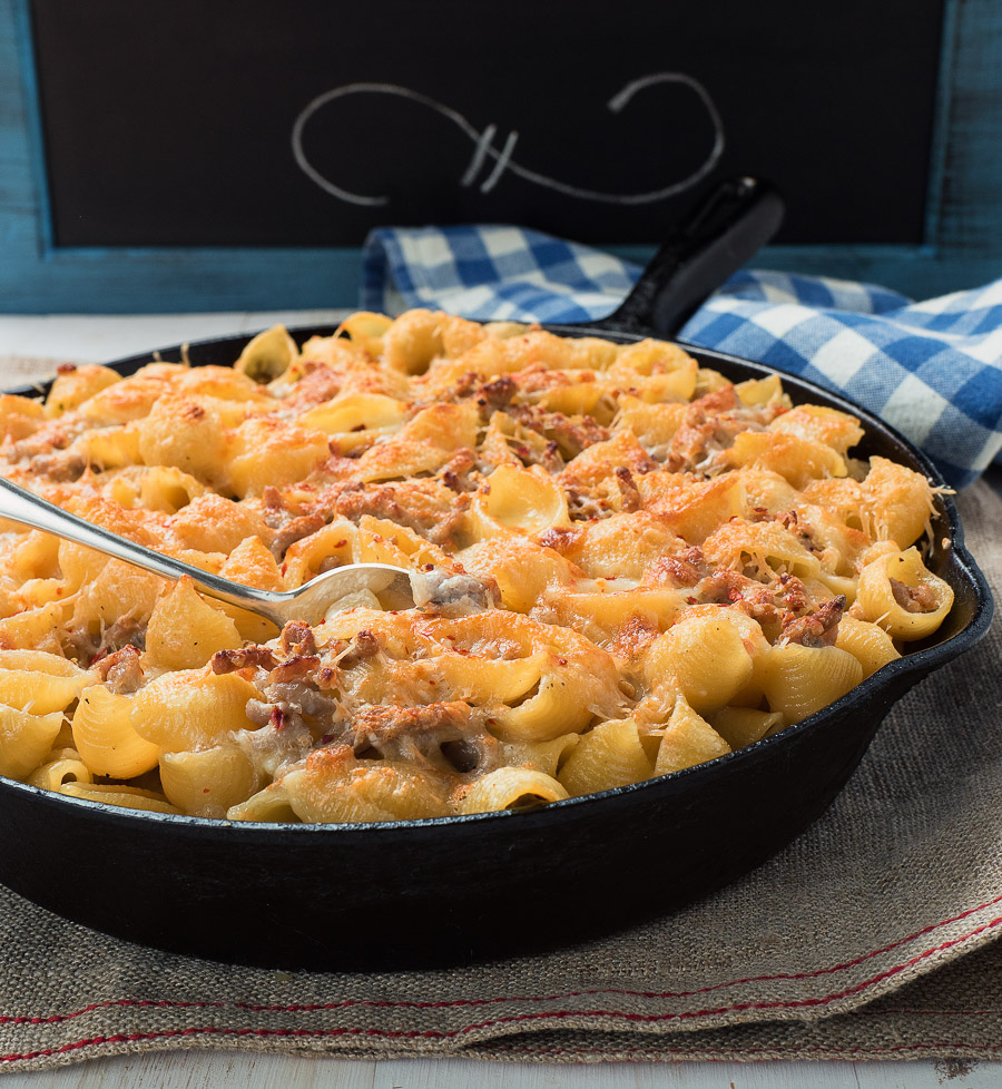 Baked pasta with sausage alfredo sauce is an easy way to get your pasta al forno fix.