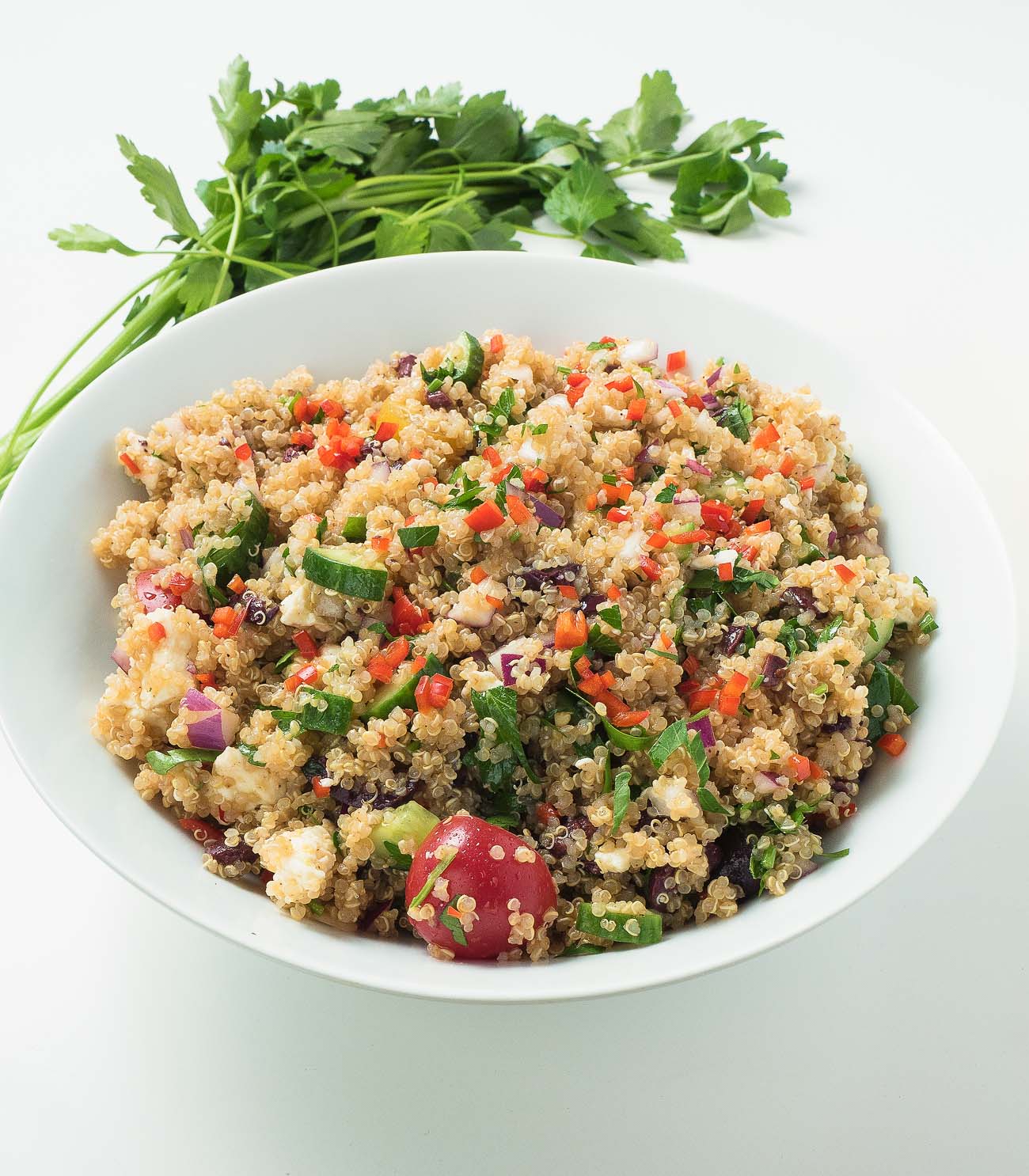 Mediterranean quinoa salad explodes with big flavours of feta, olives, lemon and tomatoes.