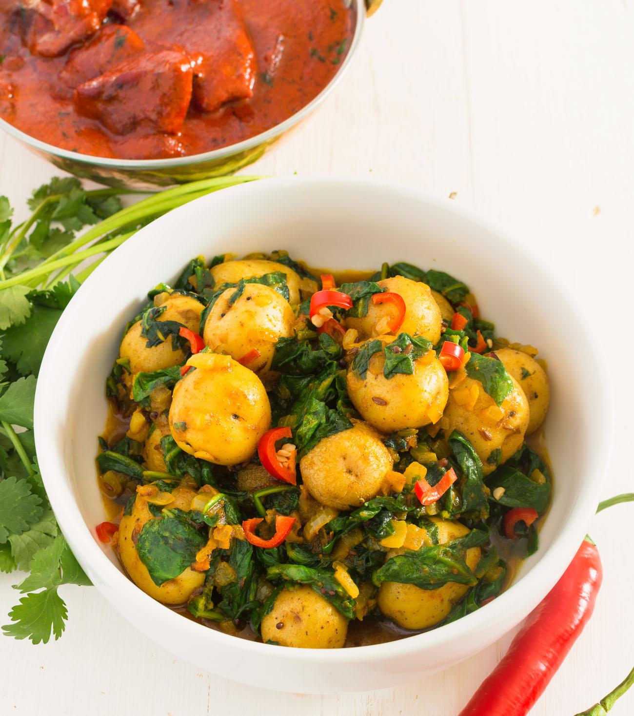 Sag aloo or spinach and potato curry is a delicious vegetarian meal.