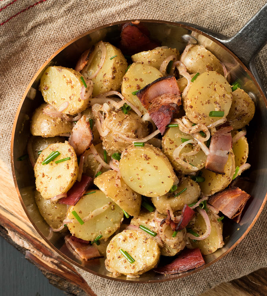 Warm potato salad with bacon makes a great side any time you grill.