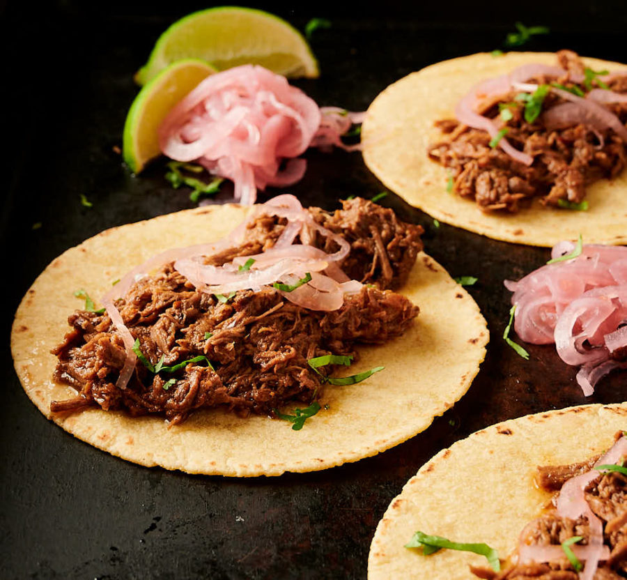 closeup of beef barbacoa taco from the front.