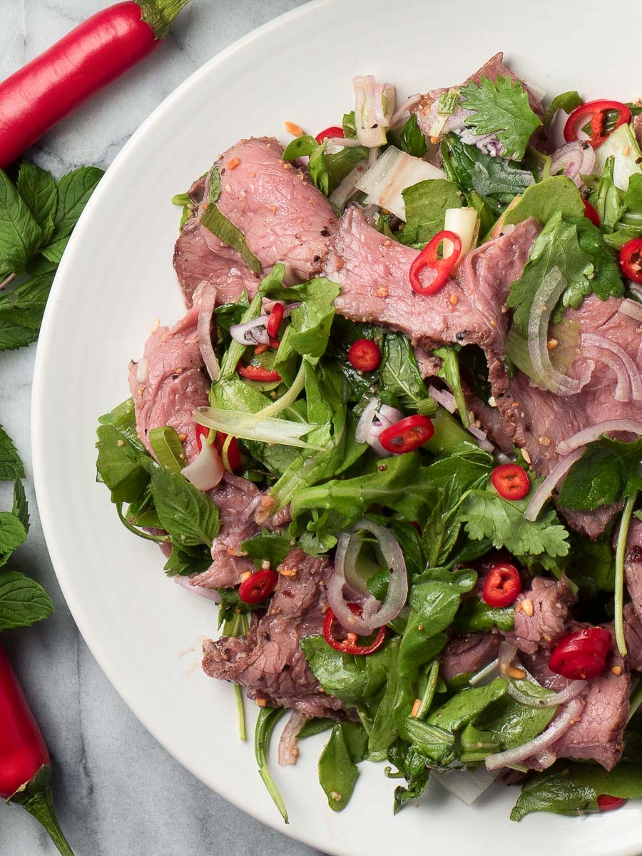 Close up of spicy beef salad from above 