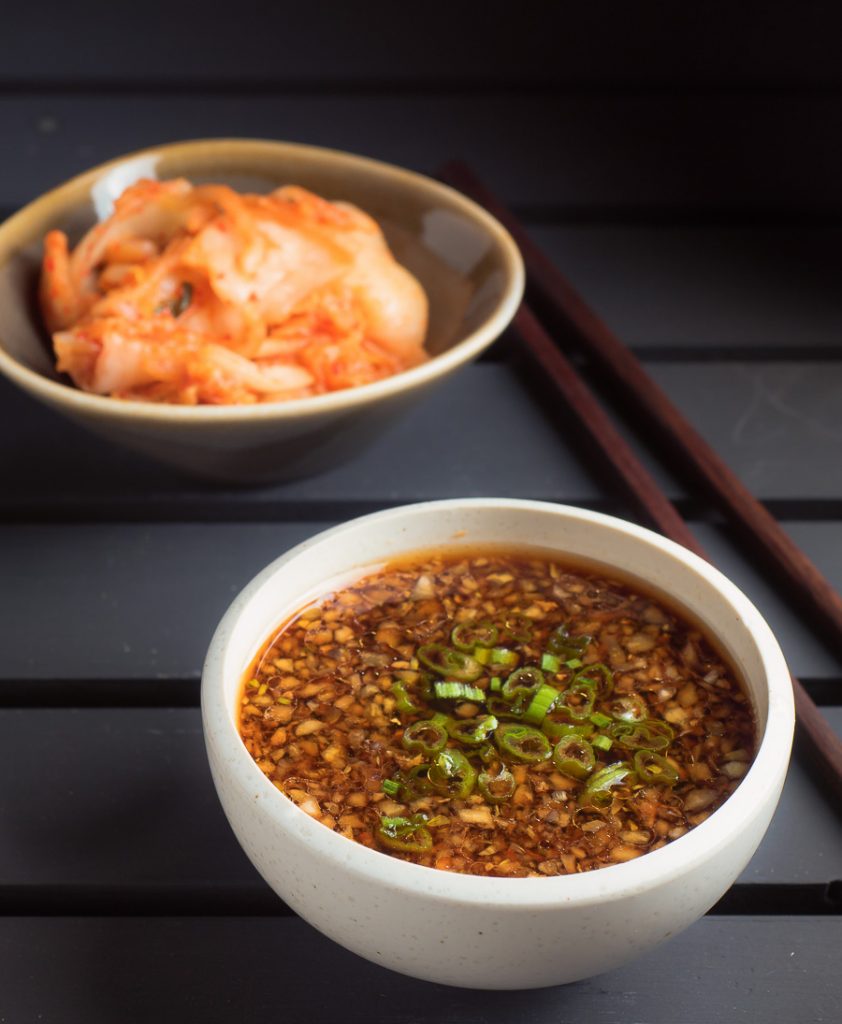 Korean bulgogi sauce in a white bowl on black background.