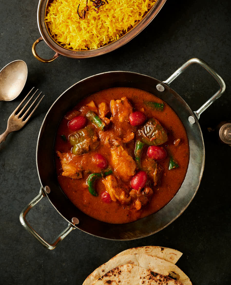 Table scene - chicken jalfrezi, rice and chapatis.