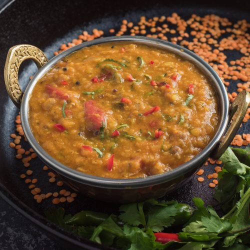 Bengali masoor dal in Indian bowl from the front.