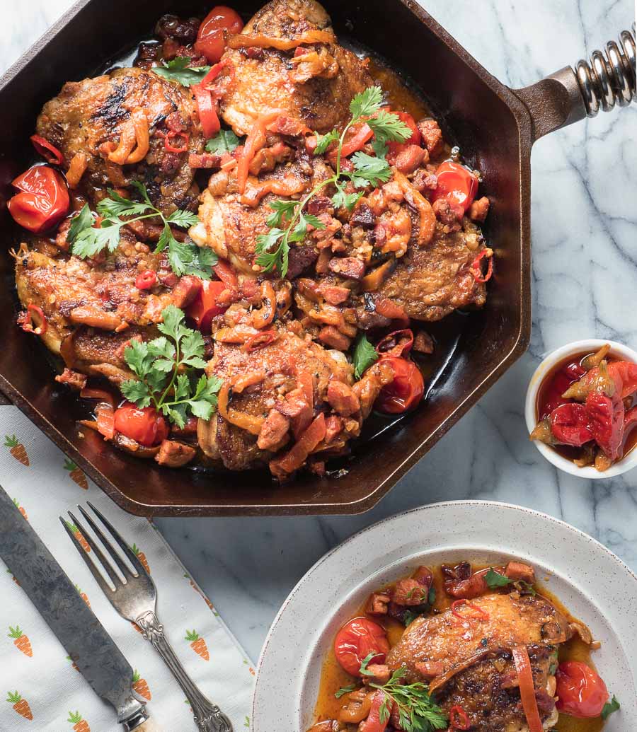 Calabrian chicken with chorizo in a cast iron skillet.