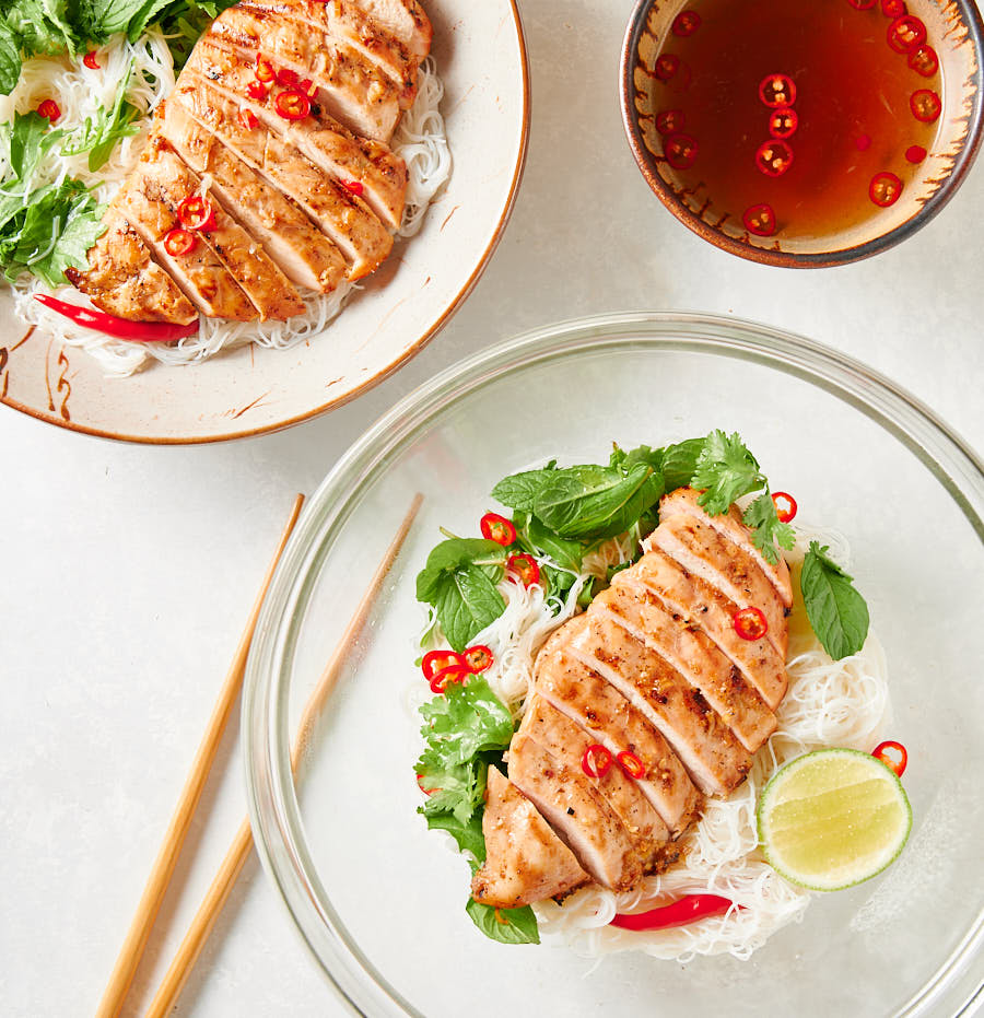 Vietnamese lemongrass chicken in a glass serving bowl from above.