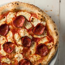 Neapolitan pepperoni and fior di latte pizza from above.