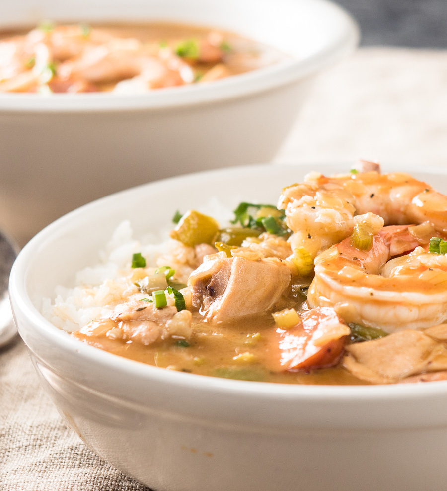 Closeup of shrimp in a bowl of gumbo.