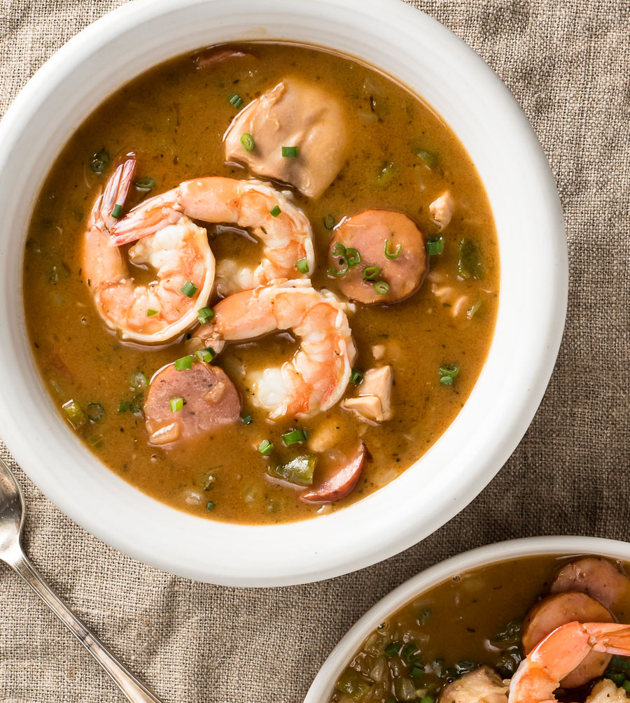 Serving dish of gumbo with chicken and shrimp from above.