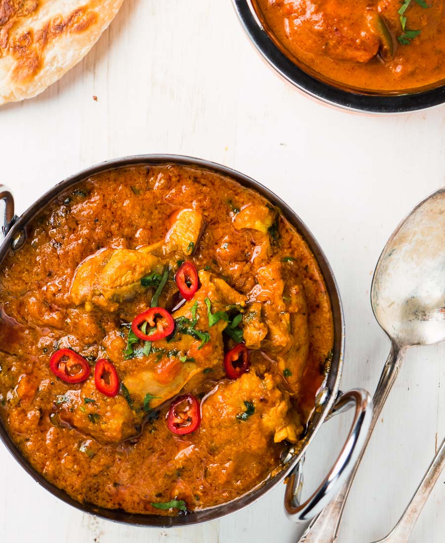 Restaurant karahi chicken curry in a bowl from above.