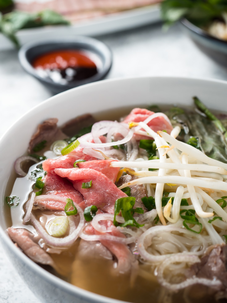 Closeup of beef in bowl of beef pho.