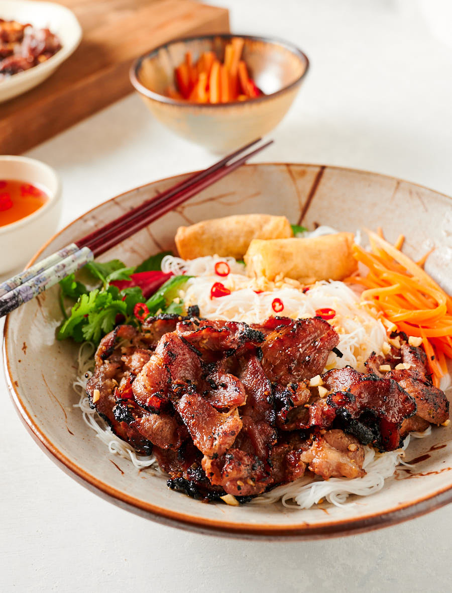 Bun thit nuong in a clay bowl from the front.