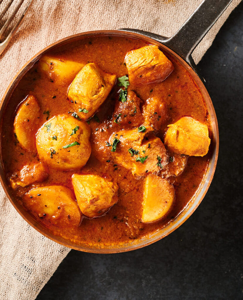 Bengali chicken curry closeup from above.