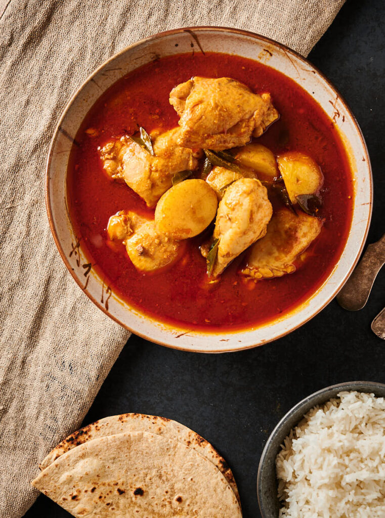 Serving bowl of kari ayam from above.