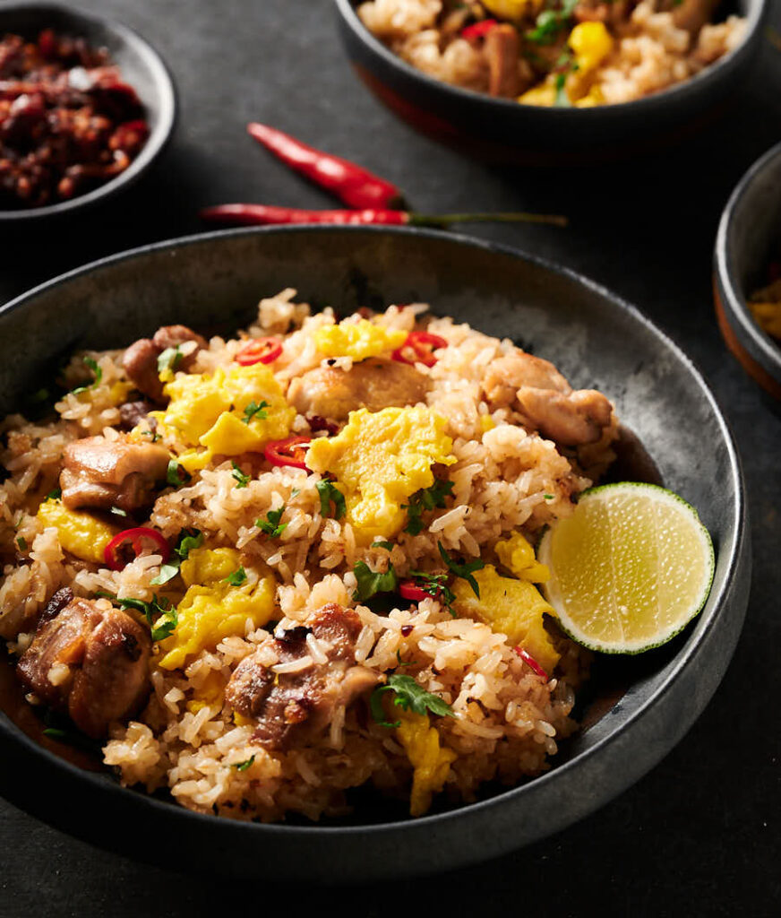 Thai fried rice with chili sauce from the front.