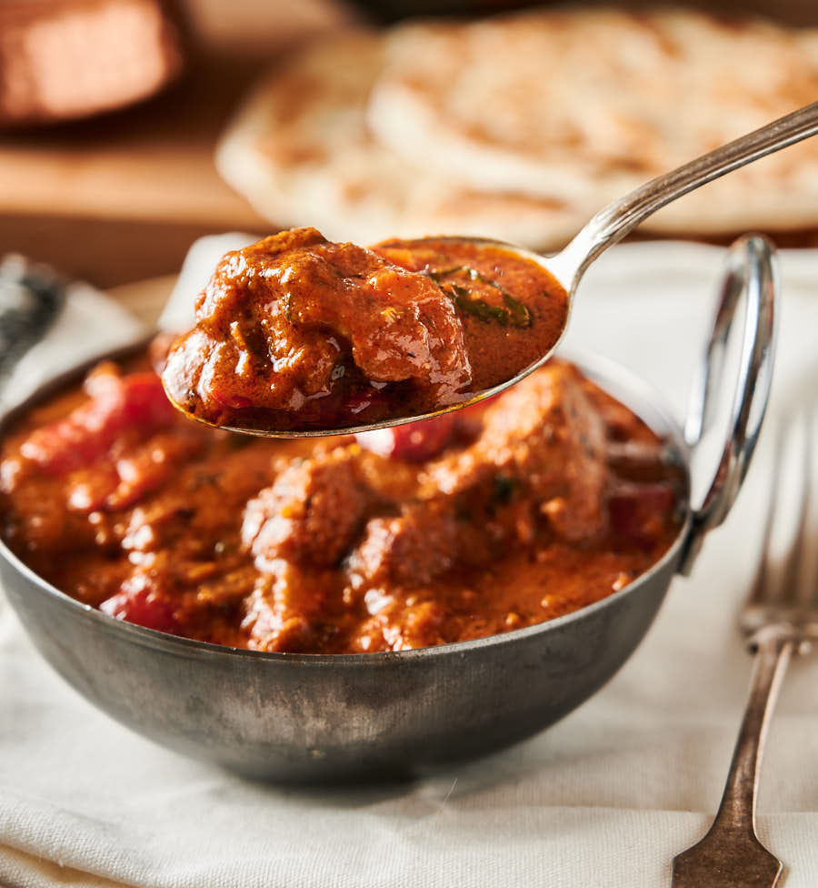 Spoonful of lamb rogan josh from the front.