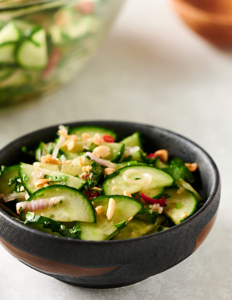 Closeup of Thai cucumber salad in a small bowl.