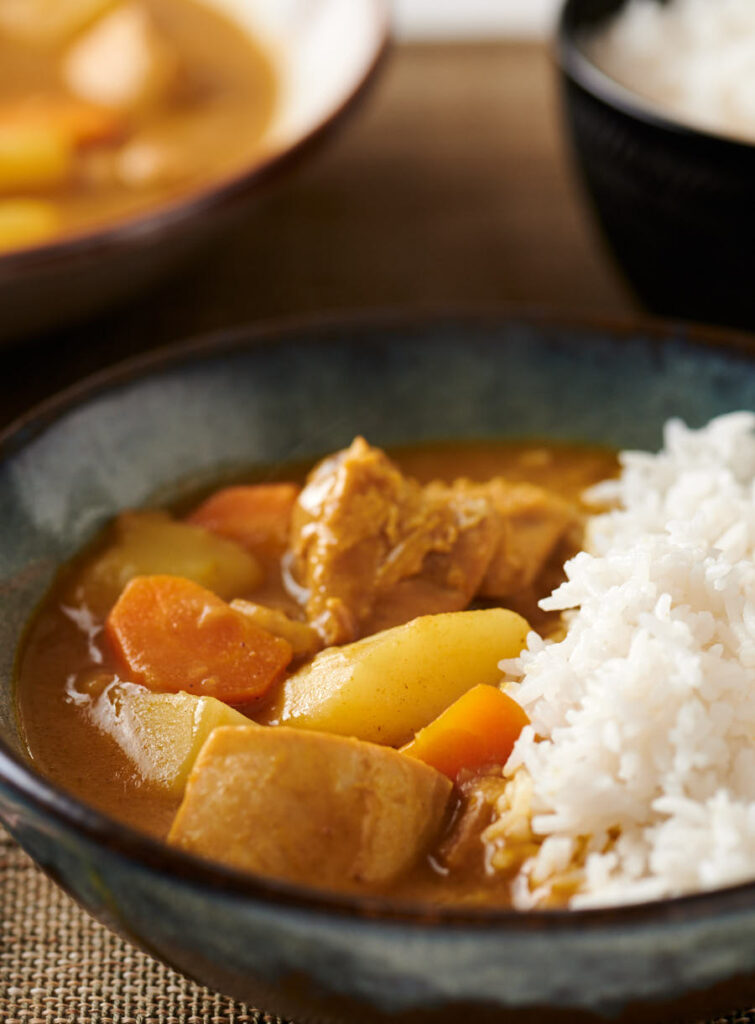 Closeup of Japanese chicken curry in a bowl from the front.