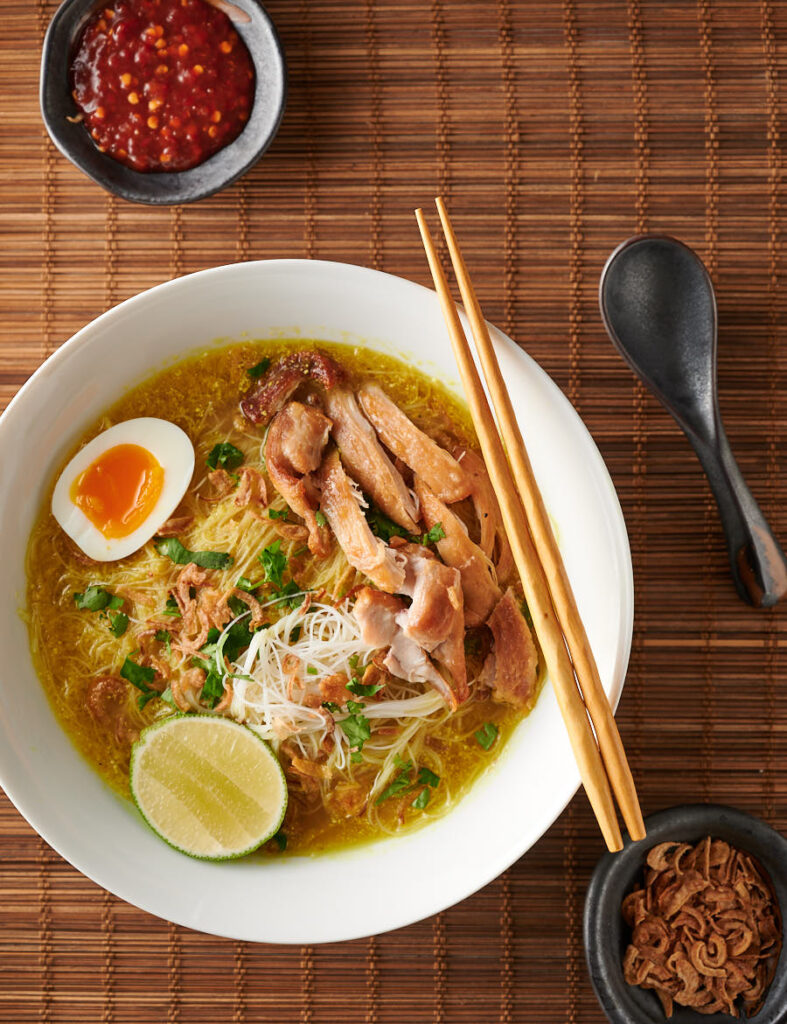 Soto ayam bowl with chopsticks from above.