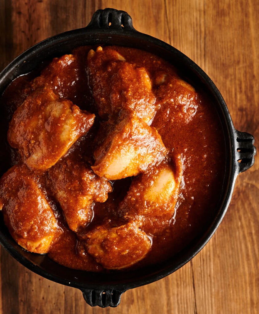 doro wat in a clay bowl from above.