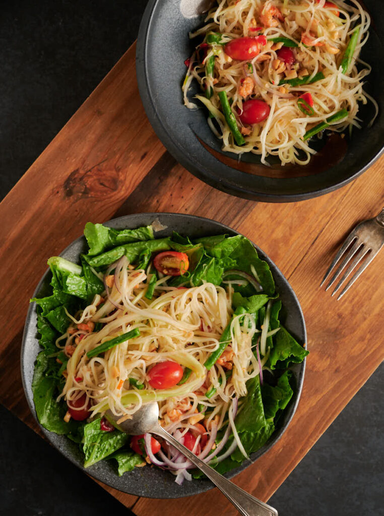 Som tam - papaya salad table scene from above.